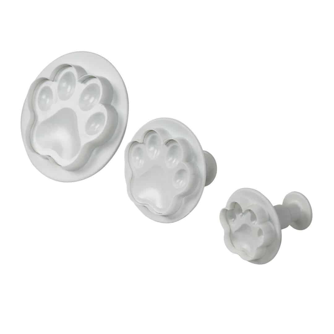 3 cortadores de galletas con forma de eyector de pata de perro