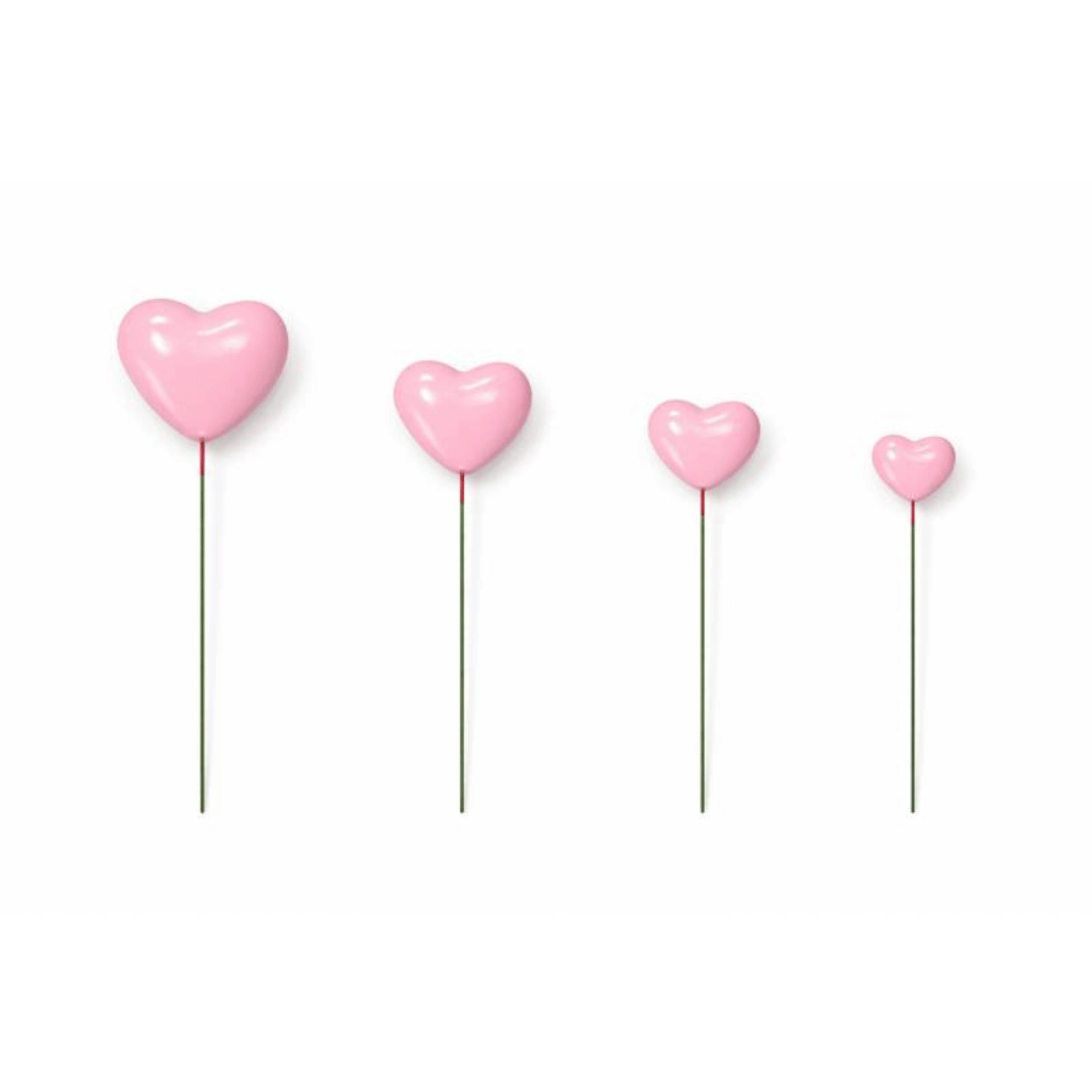 corazones decorativos de color rosa claro para pastel