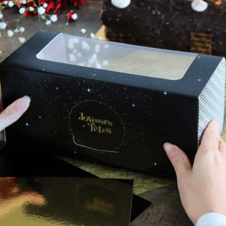Caja de madera negra con motivos dorados, felices fiestas